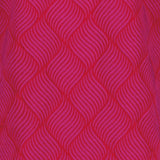 lähikuva pinkistä jacquard-kankaasta jossa on kuviointi pinkillä, oranssilla pohjalla