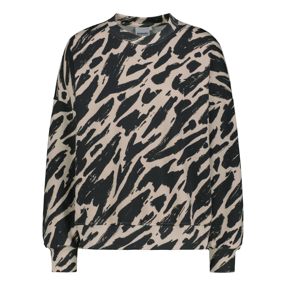 Lähikuva tuotteesta naisten oversize-mallinen musta-beige collegepaita pehmeästä luomupuuvillasta, harjattu sisäpinta